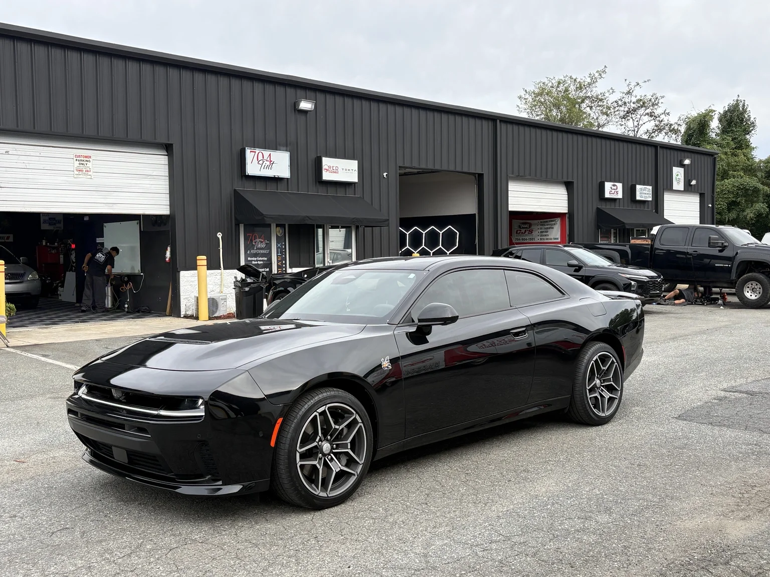 Black Dodge Charger SIXPACK with 15% Carbon FX tint on all side windows and rear glass outside 704Tint in Charlotte