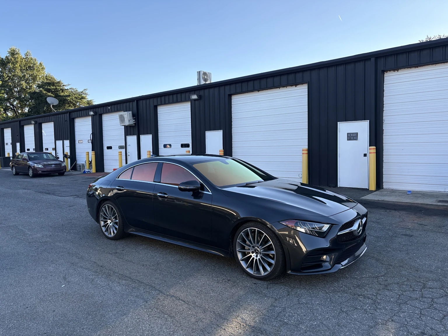 Full side and front view of a Mercedes CLS 450 with Sunset Red chameleon film