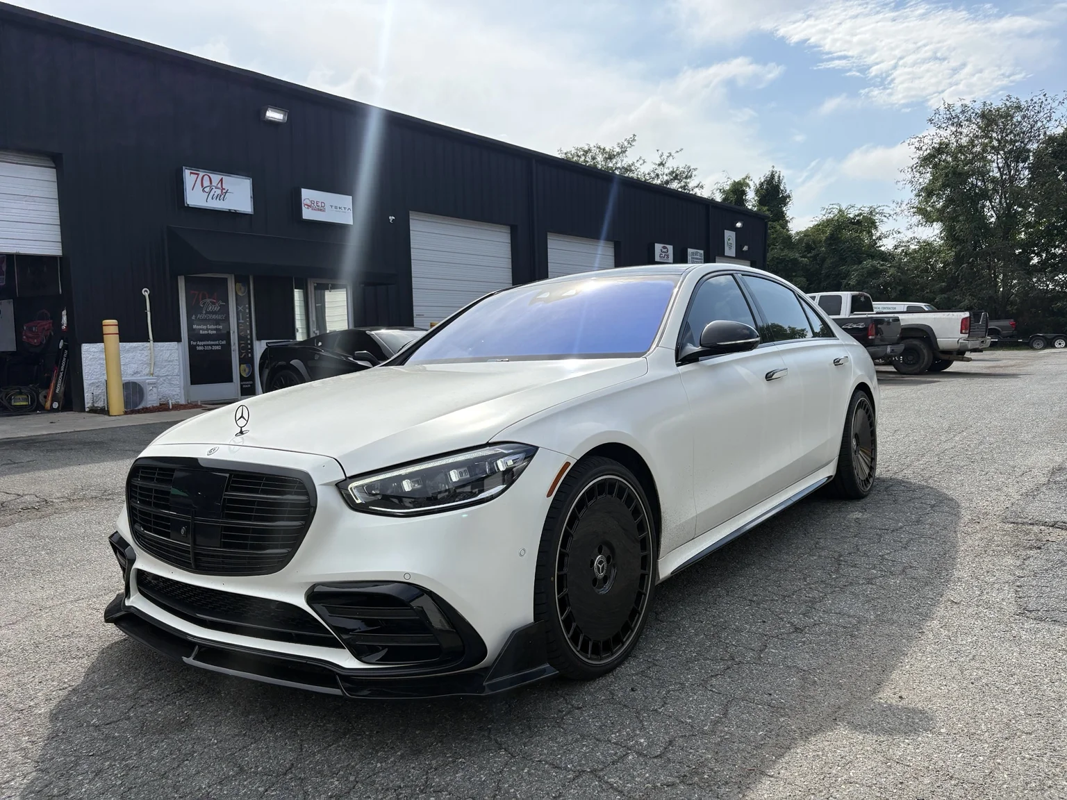 Full white Mercedes S-Class with chameleon windshield outside 704Tint in Charlotte